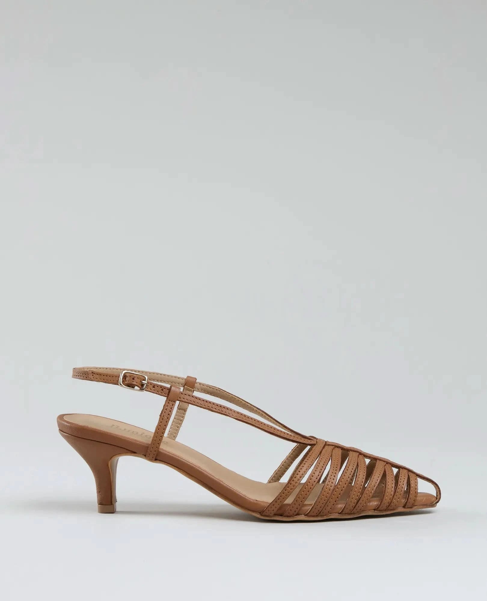 The סנדלי עקב- מיכאלה are brown strappy slingback heeled sandals with a pointed toe, low kitten heel, and buckle closure, shown against a plain light gray background.