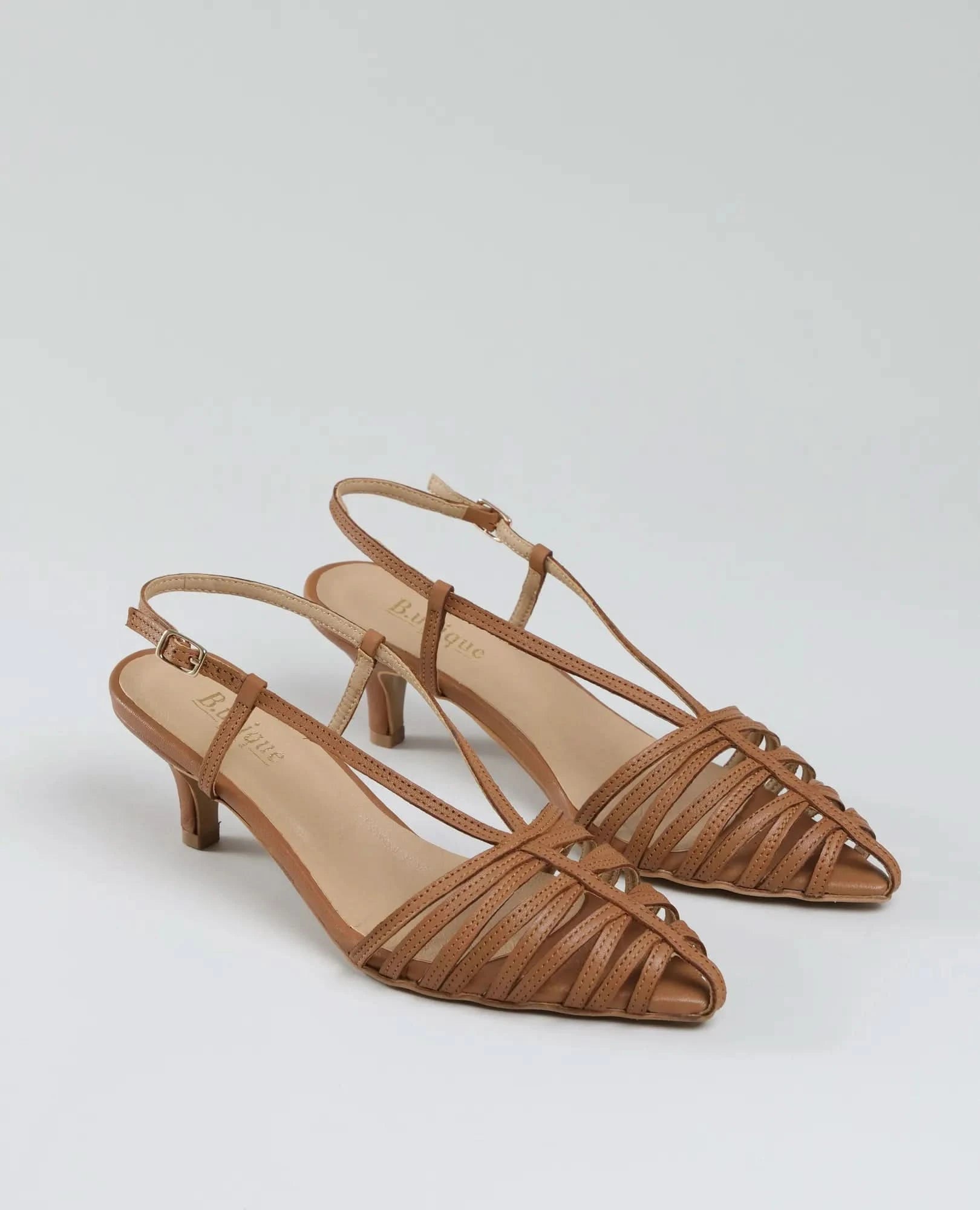 A pair of סנדלי עקב- מיכאלה: tan, strappy open-toe slingbacks with low heels and a woven design, shown on a plain light background.