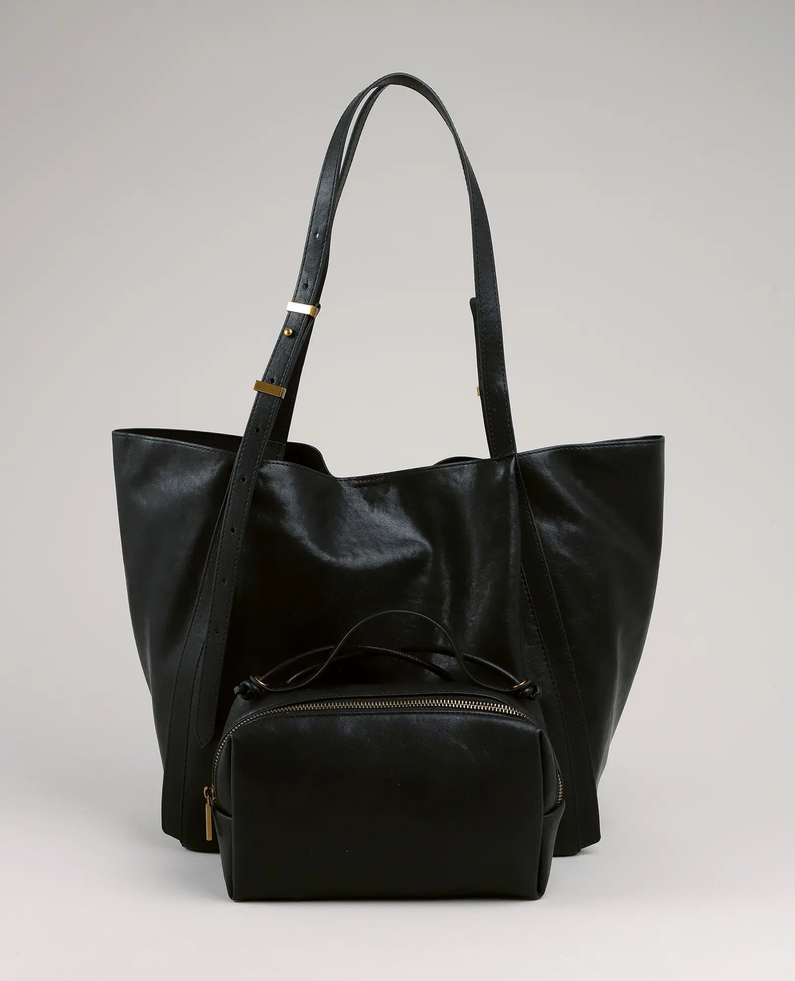 תיק צד גדול בצבע מירן מבית B-Unique Bags עם רצועה מתכווננת, כולל תיק קטן ואלגנטי תואם עם רוכסן.