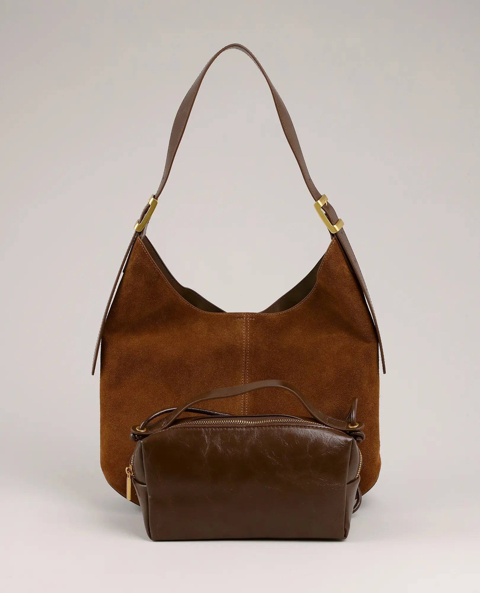 שני תיקי צד של B-Unique Bags: תיק צד מבד בשילוב עור מדגם "דיאנה" ותיק קטן עם רוכסן מוצגים יחד.